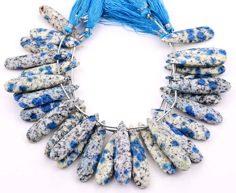 K2 Granite 10x40mm Faceted Pear gemstone bead strand