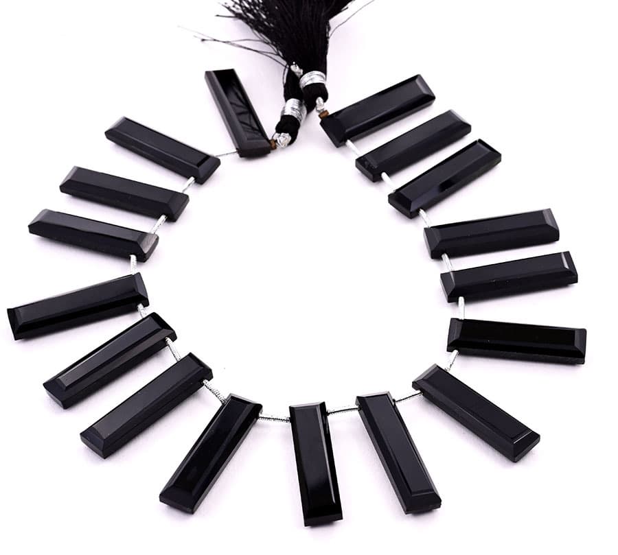 Black Onyx 7x28mm Faceted Rectangle gemstone bead strand