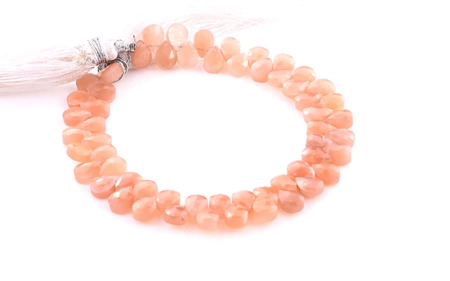 Peach Moonstone 5X7mm Faceted Pear(Calibrated) gemstone bead strand