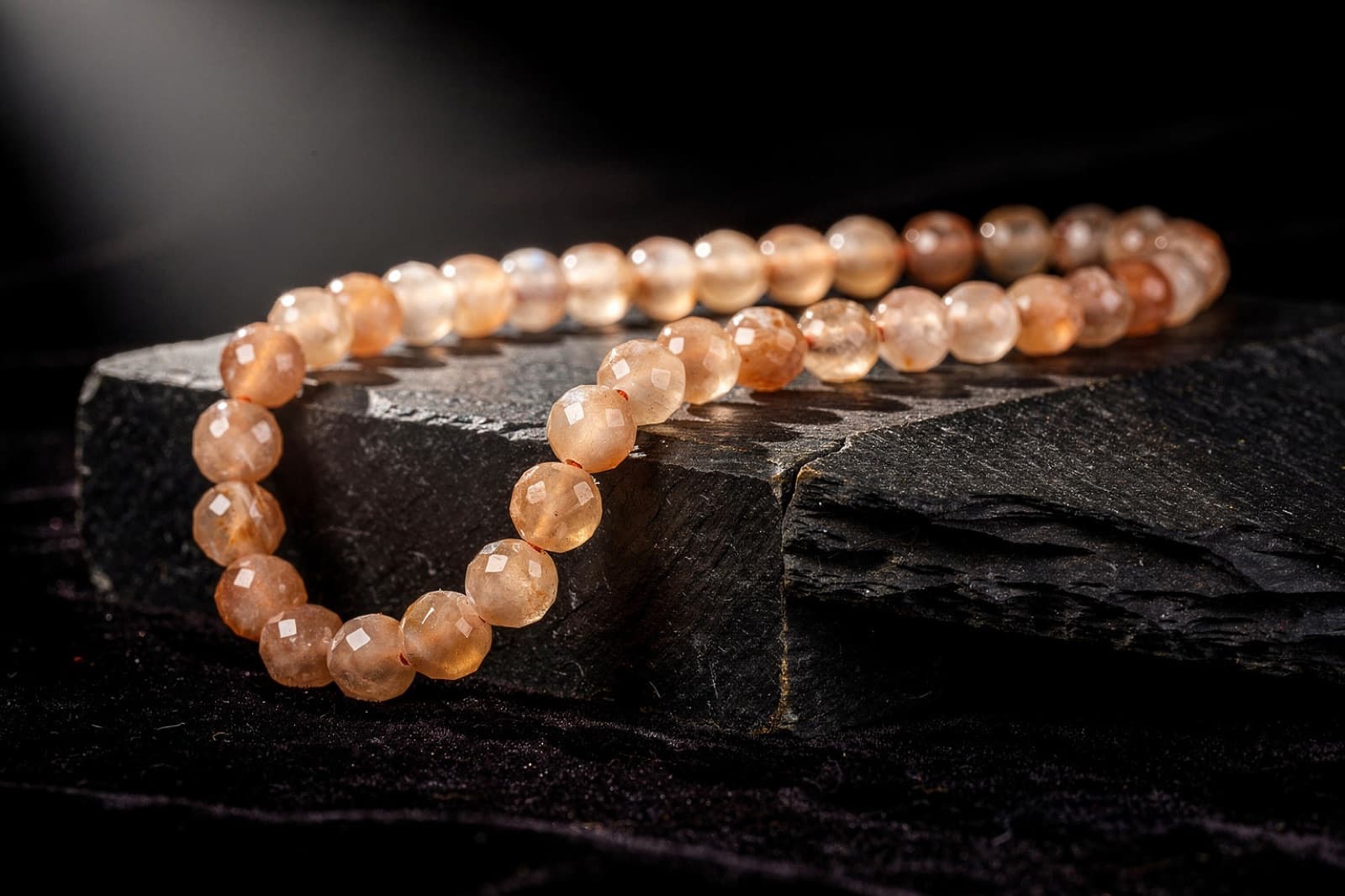 Peach, gray, chocolate and golden-shine moonstone beads, styled illustration