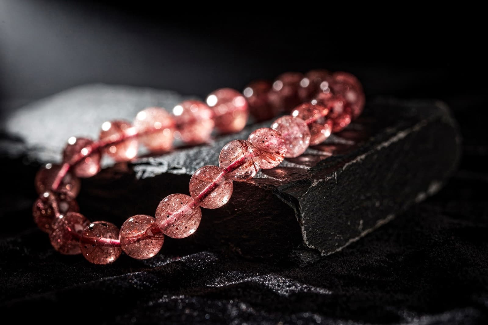 Strawberry quartz and red aventurine beads, styled illustration