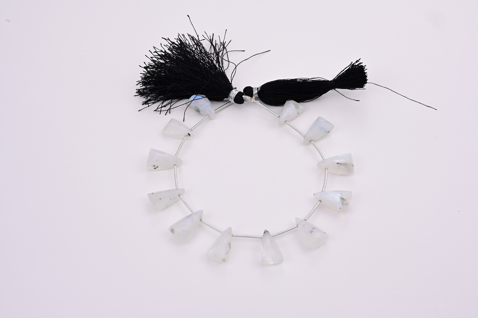 Rainbow moonstone strand, a photograph from the Tandon Gems archive