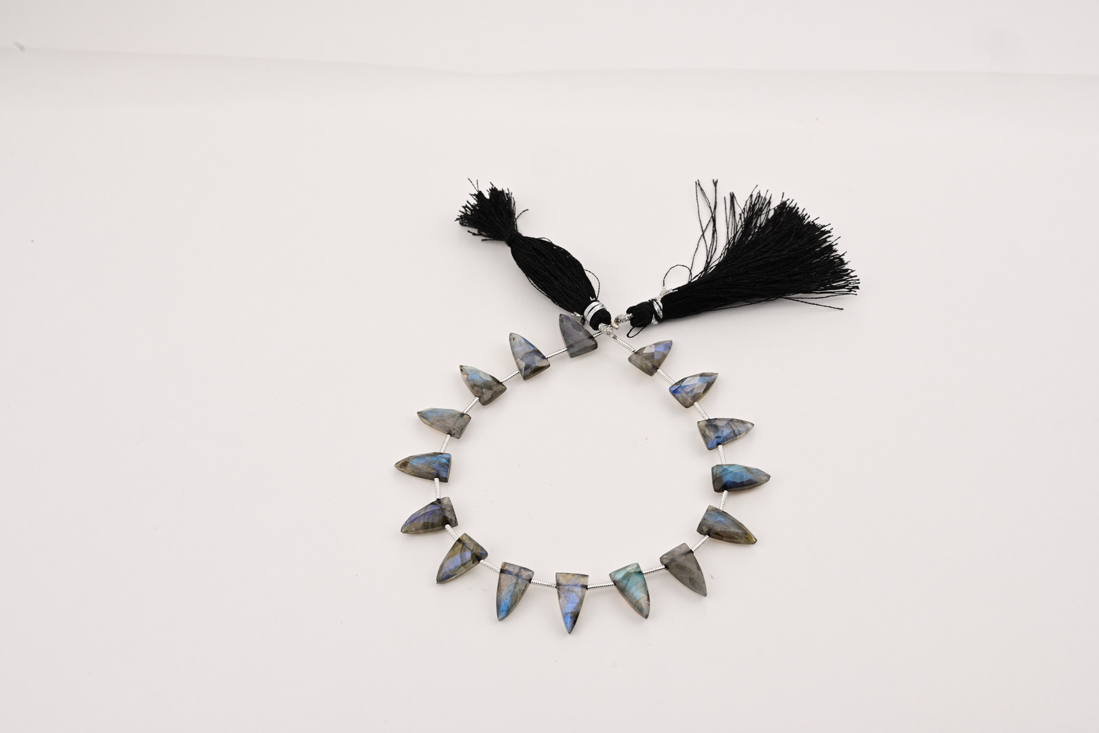 Labradorite strand, a photograph from the Tandon Gems archive